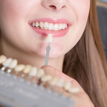 Woman considering teeth whitening